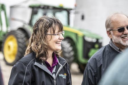 Crop consultant standing in peanut field.